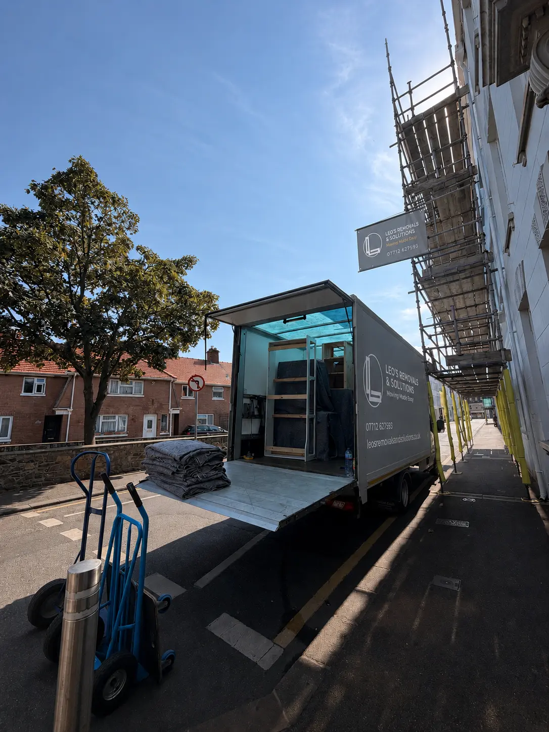 Leo's Removals truck parked on a residential street